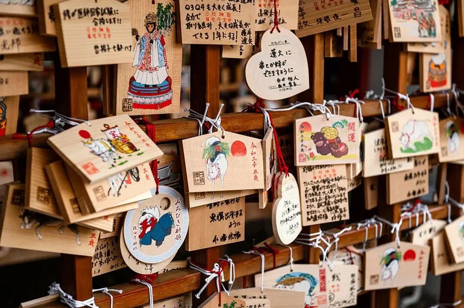 Wooden ema prayer plaques hanging at a Japanese shrine