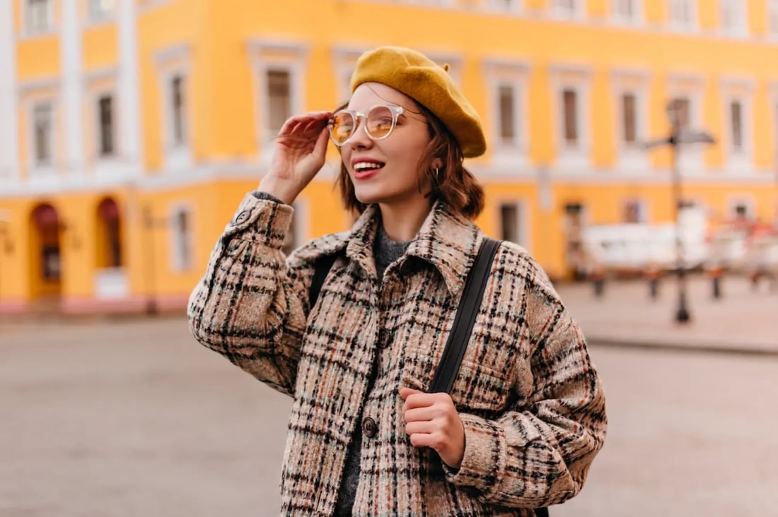 close-up-portrait-young-woman-sunglasses-admiring-cityscape