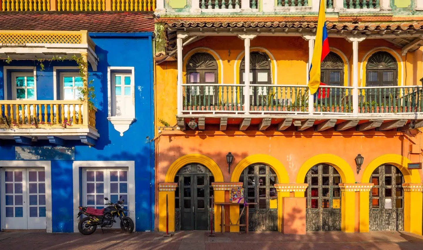 Blue and orange colonial buildings with balconies in Cartagena's Old Town, Colombia