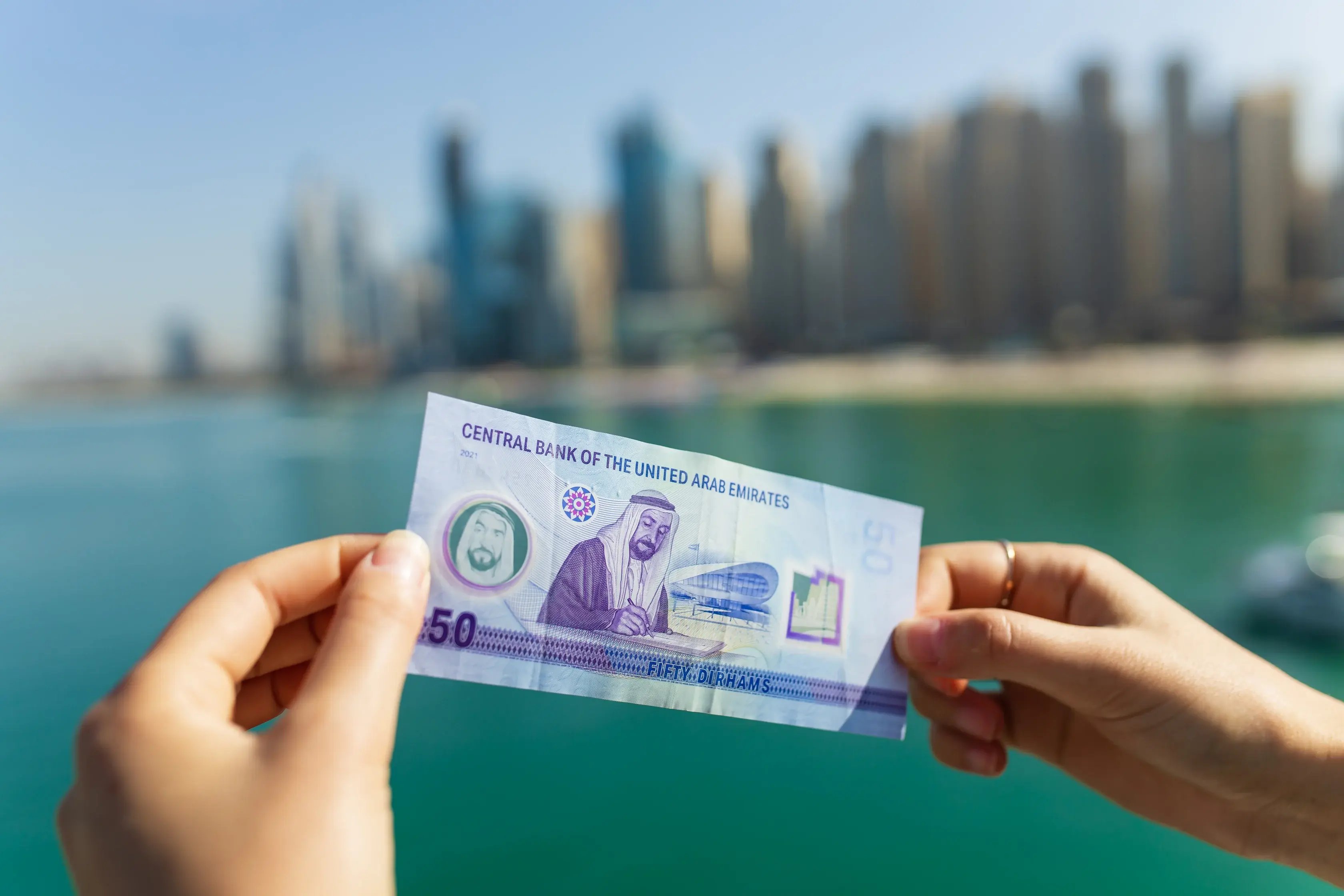 money-in-hands-background-dubai-city-amazing-city