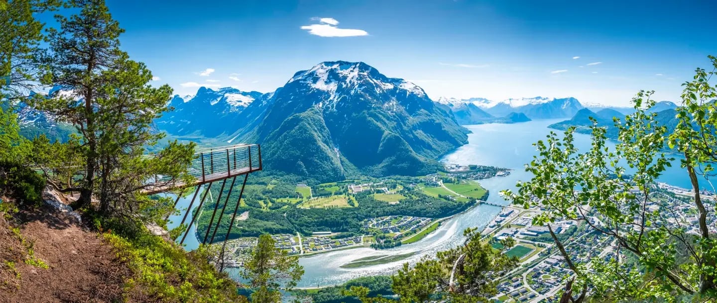 Panoramic view from the top of Rampestreken viewpoint over Romsdalen valley and the town of Åndalsnes, Norway.