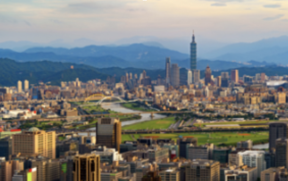 Aerial view of Taipei's skyline with Taipei 101 and the river at golden hour