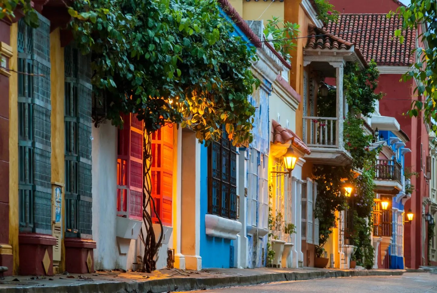 Colourful balconies lit up at dusk in Cartagena's walled Old Town, Colombia