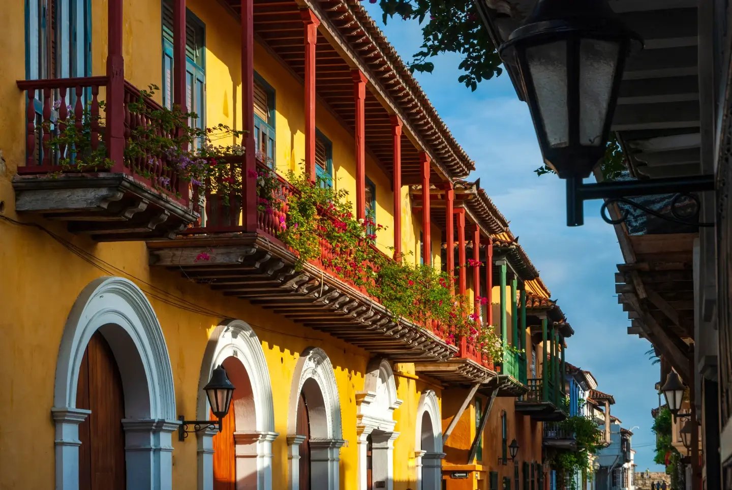 Colourful colonial building with plant-draped balconies in a Colombian old town