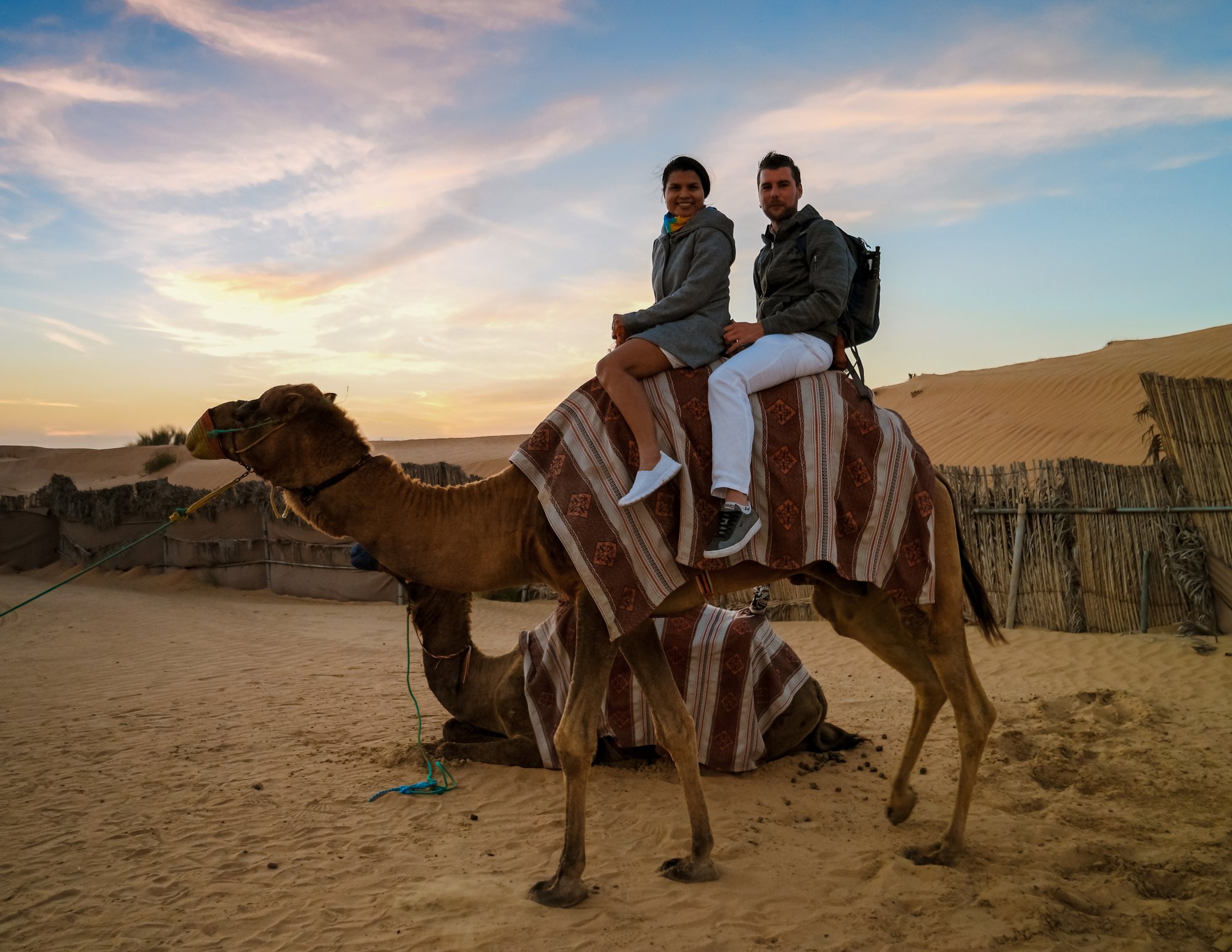 couple-riding-a-camel-during-dubai-desert-safari-a-2026-09-23-01-45-54-utc
