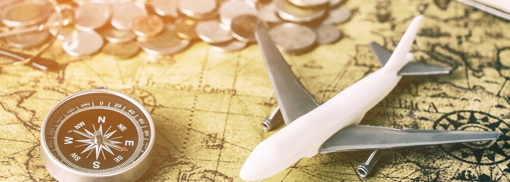 airplane with coins for currency exchange